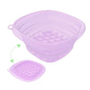 A purple foldable silicone ice bath and facial massage bowl with a matching lid.