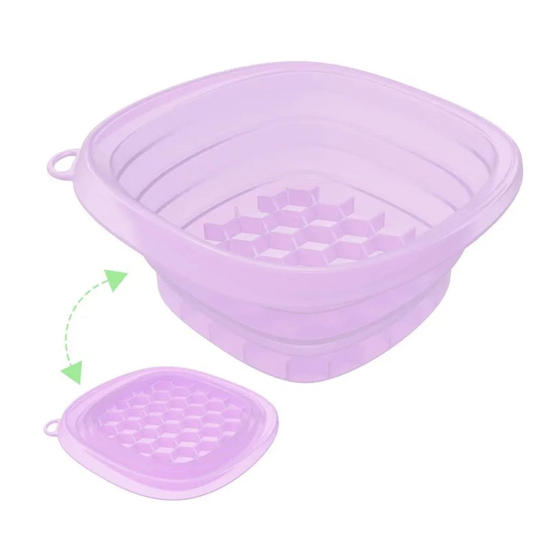 A purple foldable silicone ice bath and facial massage bowl with a matching lid.