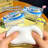 Hands squeezing a white squishy stress relief fidget ball next to its packaging.