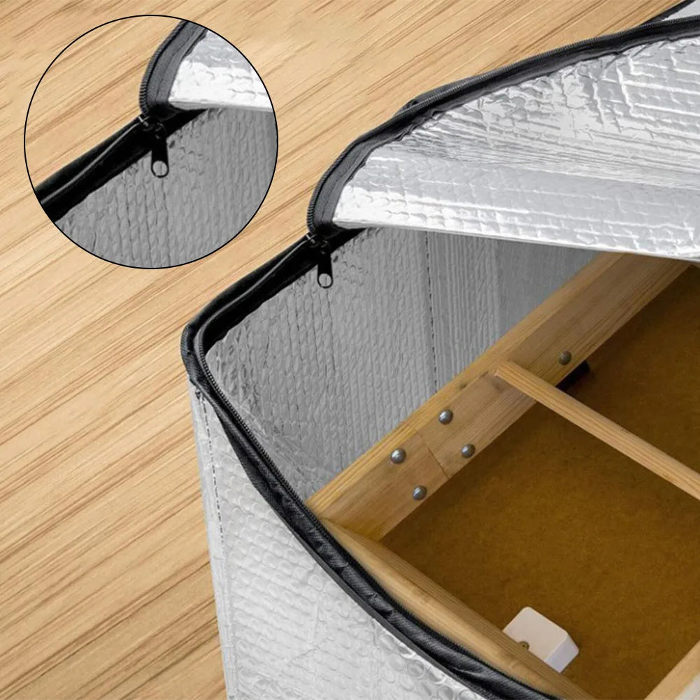 Close-up view of an attic stairway insulation cover with a sealed barrier and zippered flap.