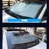 Two views of a retractable car windshield sunshade, showing the front and rear installation.