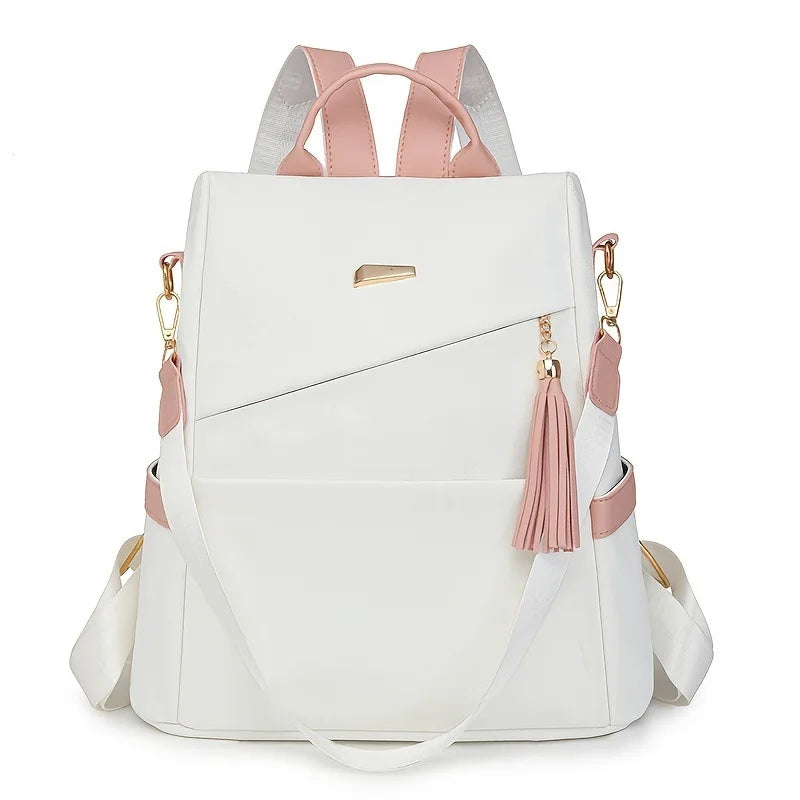 A white vegan leather backpack with pink accents and a laptop compartment.