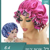 A model wears a pink double-layer satin hair bonnet while a baby wears a blue version.