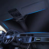 Interior view of a car showing blue LED light strips and a dashboard with a foldable windshield sun shade cover.