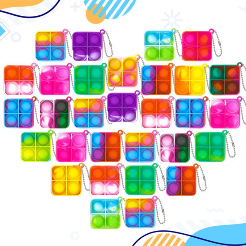 A set of colorful mini pop keychain fidget toys in various colors and shapes.