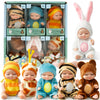 A collection of mini reborn baby dolls with various outfits and accessories displayed in packaging.