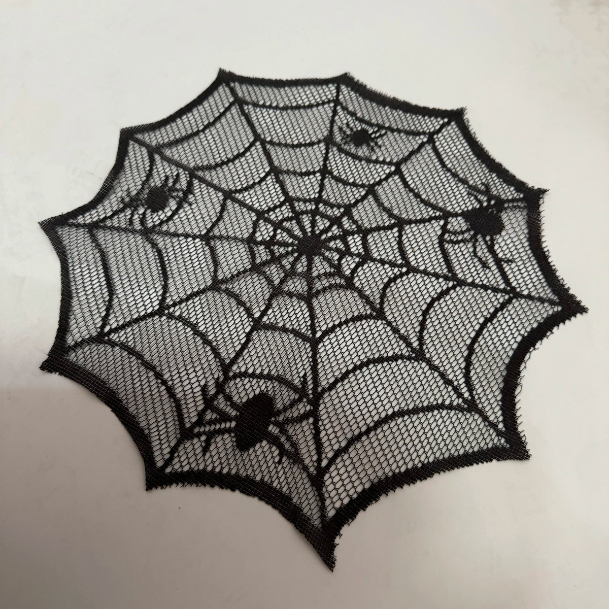 Black disposable spider web Halloween table runner or placemat set