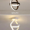 Modern clover-shaped LED ceiling light fixture with a white frame and glowing light effect.