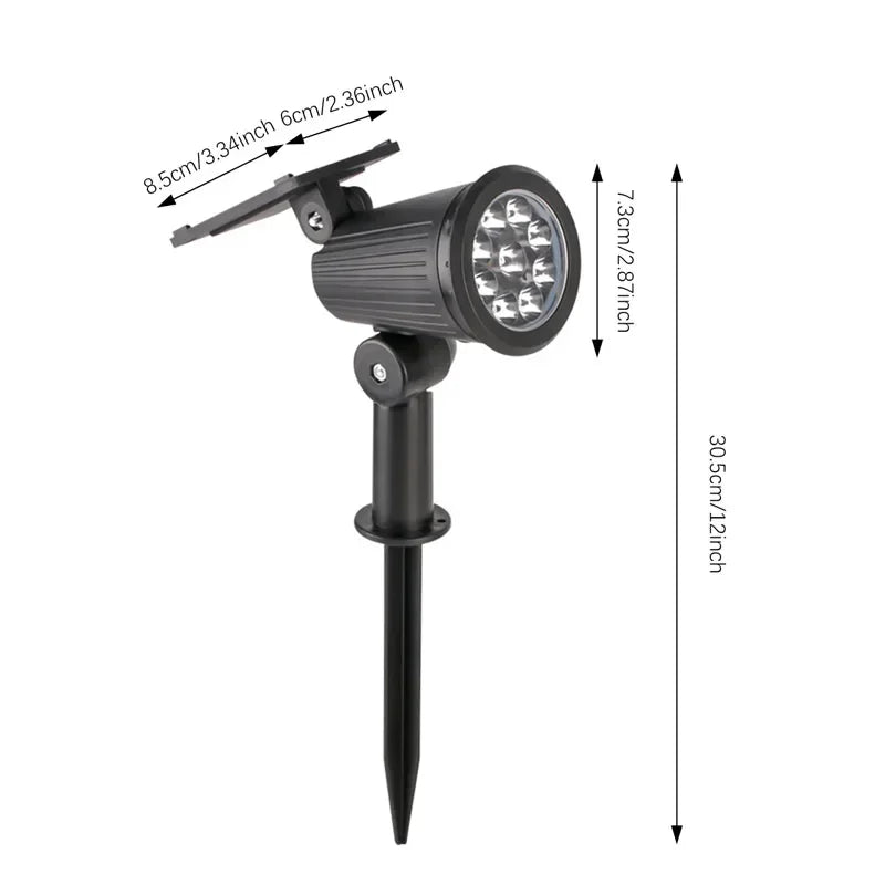 A black solar-powered LED spotlight with a directional beam and a long shaft.