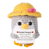 Handmade knitted yellow penguin doll with a pink flower and a card