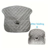A gray leak-proof baby seat pad shown in its unfolded and folded states.