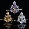 Hand-painted Monkey King figurine in gold and silver armor holding a staff, displayed against a black background.