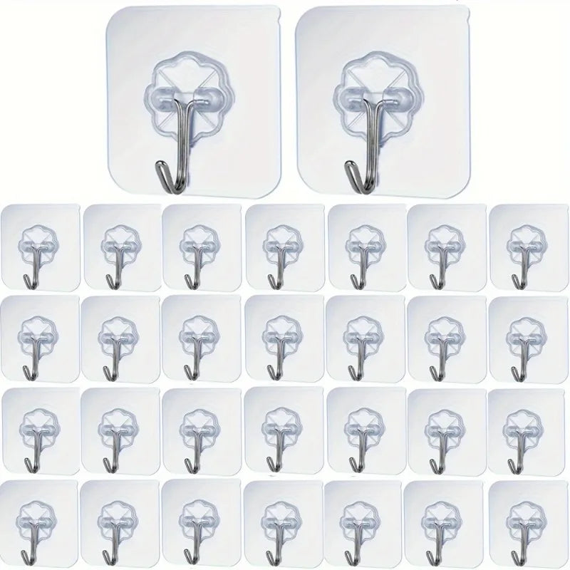 A set of clear heavy-duty self-adhesive wall hooks in various sizes and shapes.