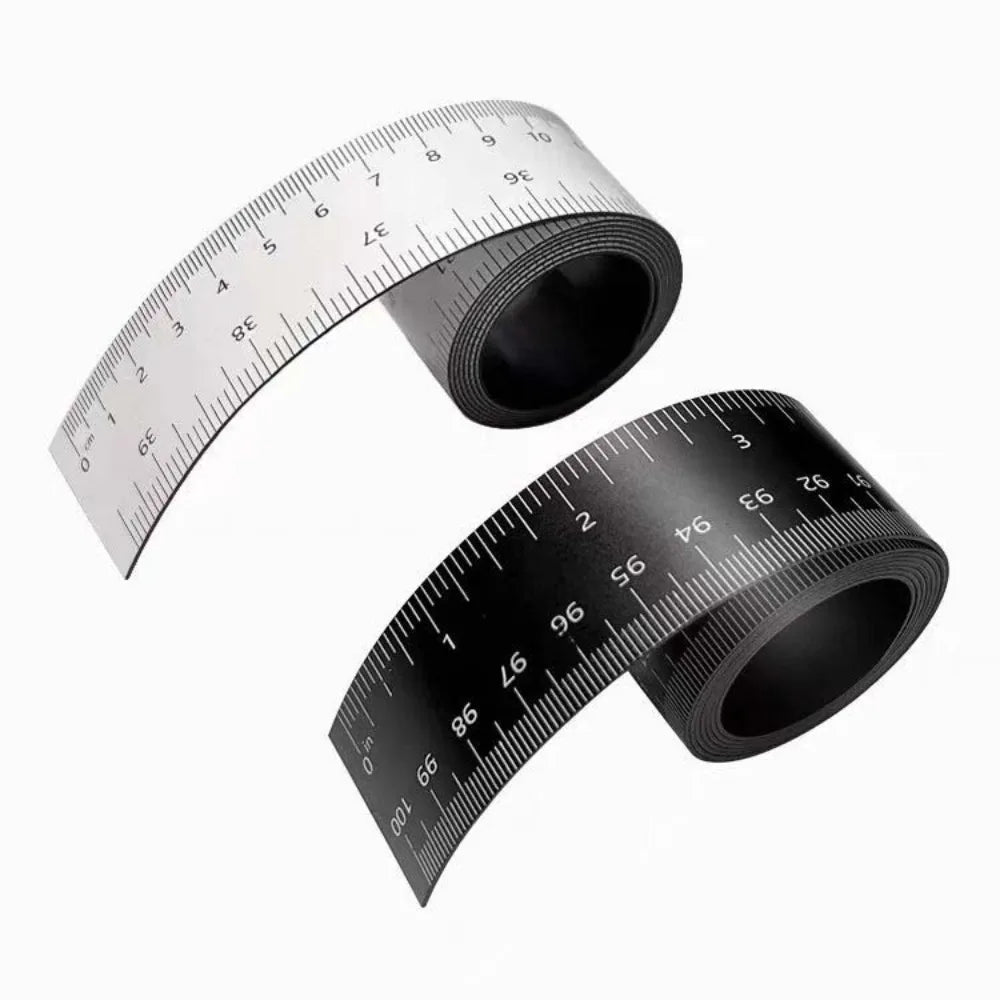 A black magnetic flexible measuring ruler with dual scales shown at an angle.