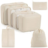 A set of beige travel packing cubes and storage organizer bags shown in various sizes.
