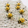 A collection of yellow and black 3D bee silicone beads for jewelry making and DIY crafts