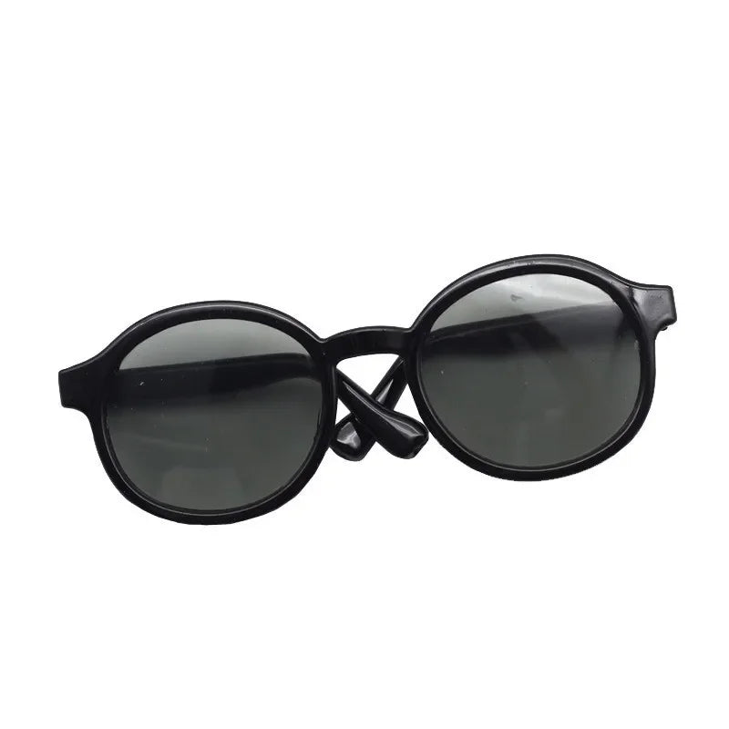 Black plastic sunglasses with dark lenses for dolls