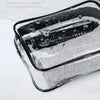 A clear PVC travel makeup and toiletry organizer bag with a zipper, showing wet separation in order.