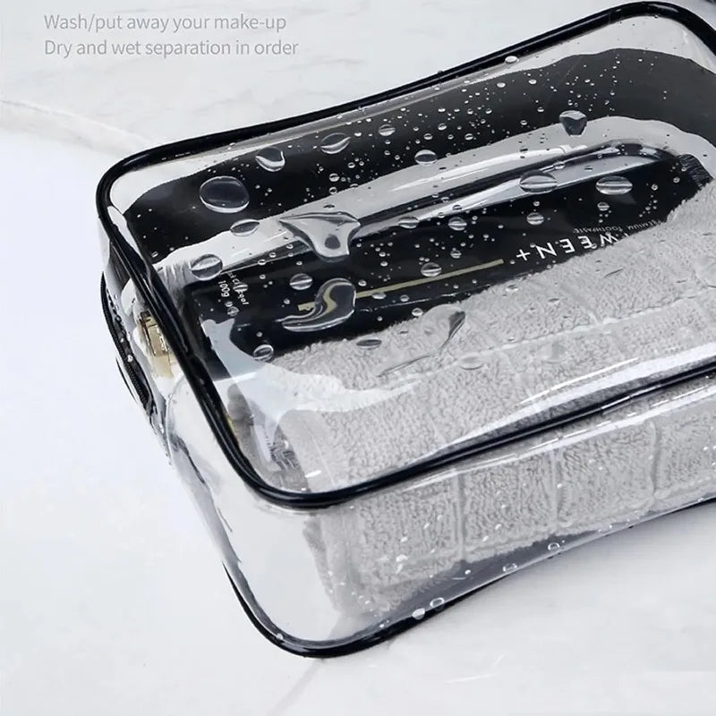 A clear PVC travel makeup and toiletry organizer bag with a zipper, showing wet separation in order.