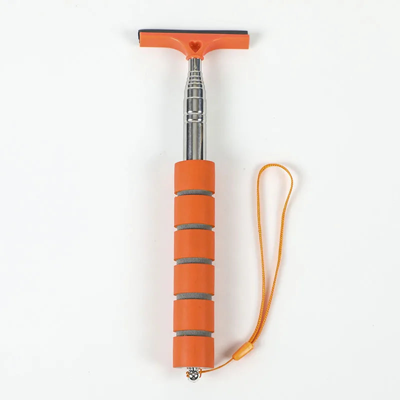 An orange retractable car mirror and window cleaning wiper with a silver handle and orange cord.