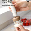 A hand is using a white kitchen faucet sprayer with a filter to clean a faucet.