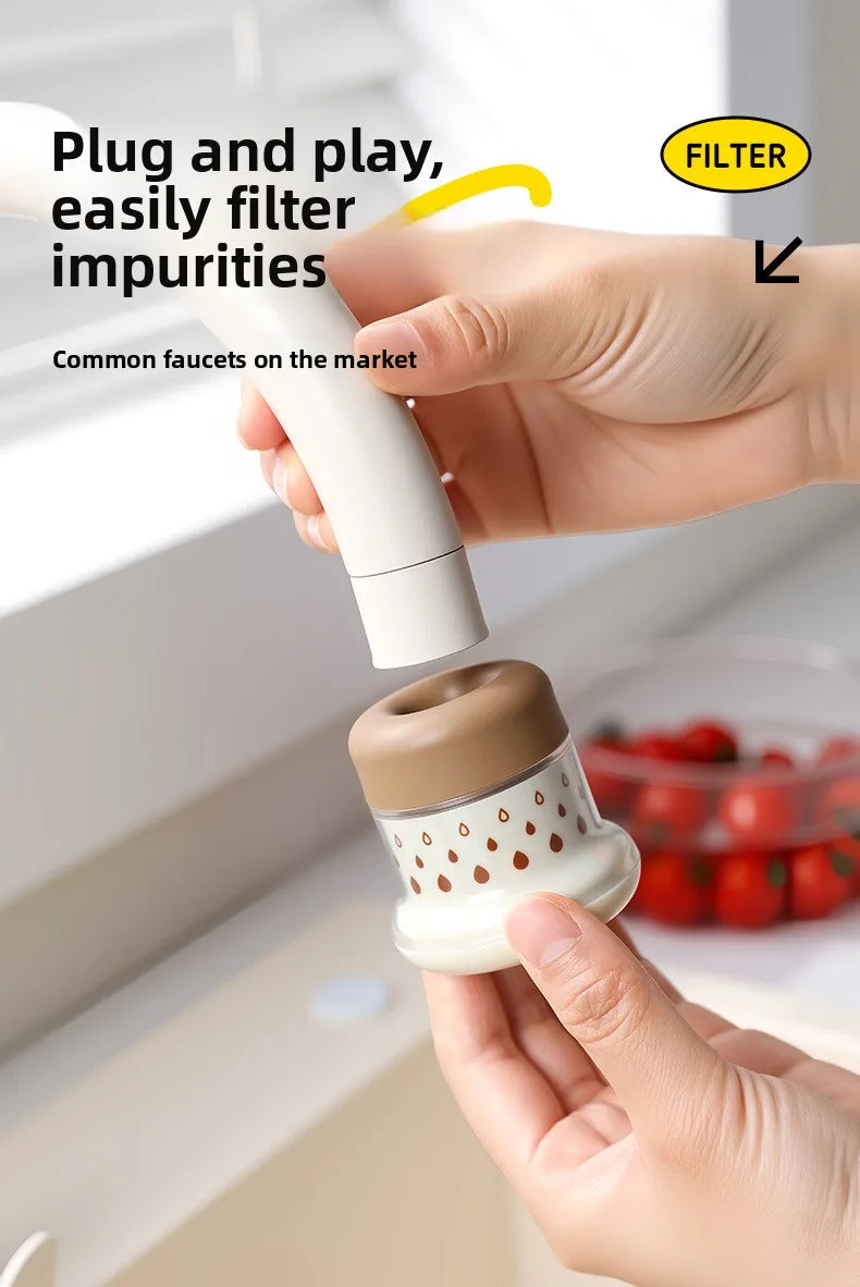 A hand is using a white kitchen faucet sprayer with a filter to clean a faucet.