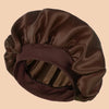 A dark brown satin wide brim shower cap is shown from above, folded and ready for use.
