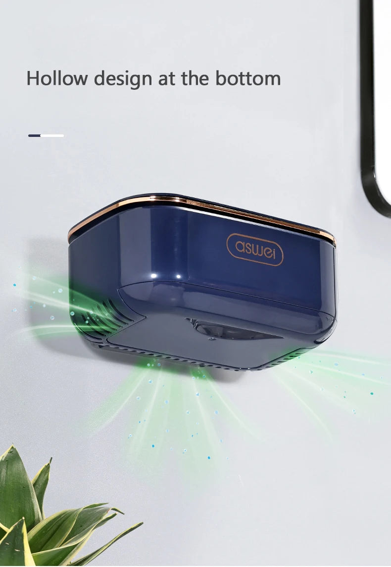 A dark blue, oval-shaped soap holder with a hollow design is mounted on a white wall.