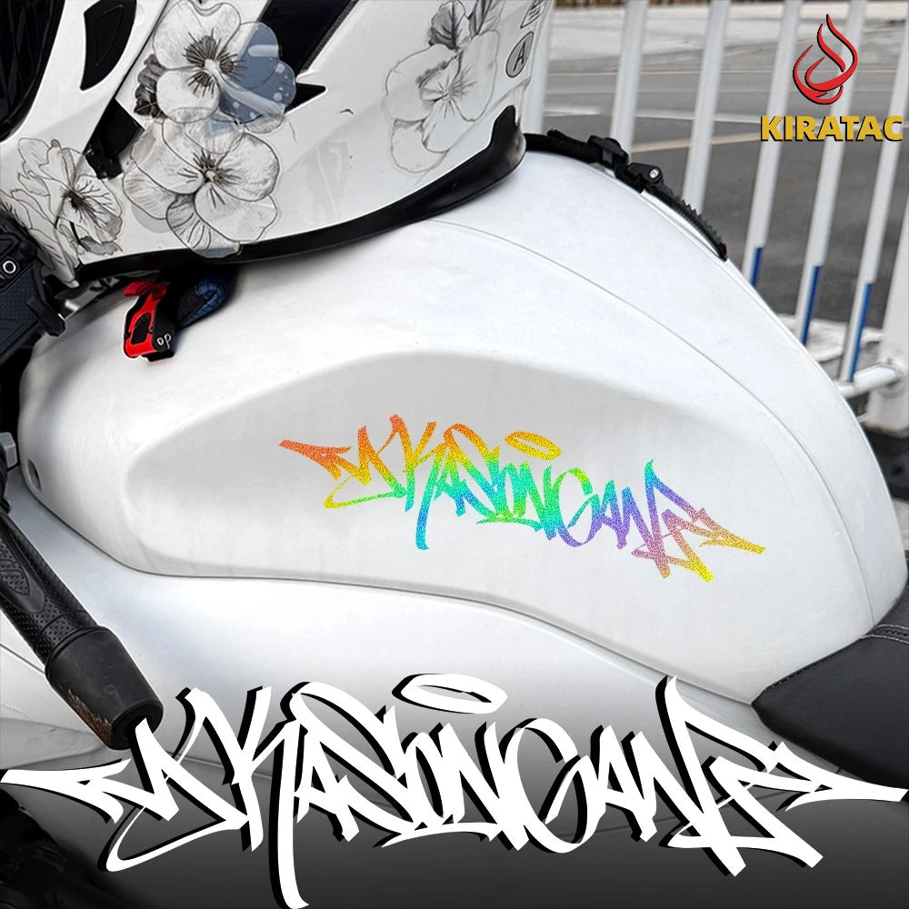 A close-up of a white motorcycle helmet featuring colorful wildstyle graffiti decals and black accents.