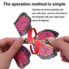 Hands demonstrate the operation method for a magic flying butterfly wind-up toy