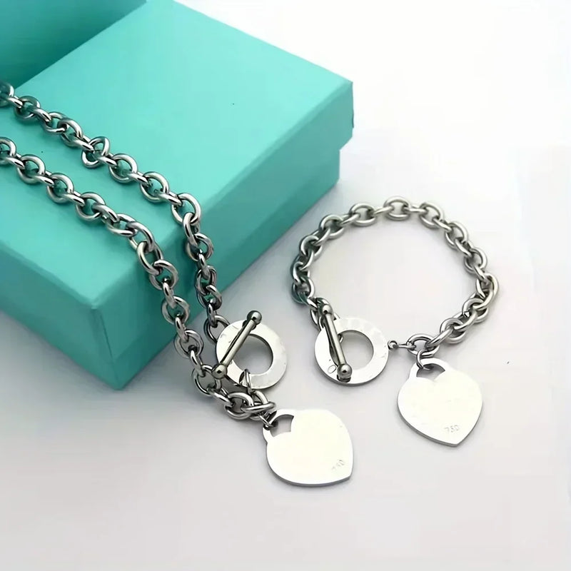 Bracelet en acier inoxydable avec pendentif double cœur