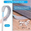 A long flat flexible duster with a telescopic handle is shown cleaning bottom gaps of furniture.