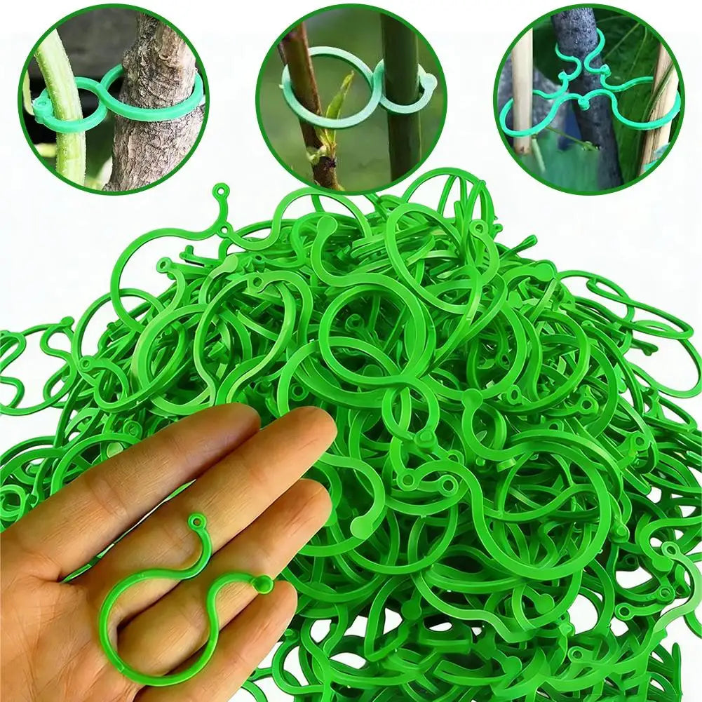 A hand holds a large bundle of green reusable vine strapping ties used for garden plant support.