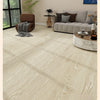 Light wood grain peel-and-stick floor stickers installed on a modern living room floor.