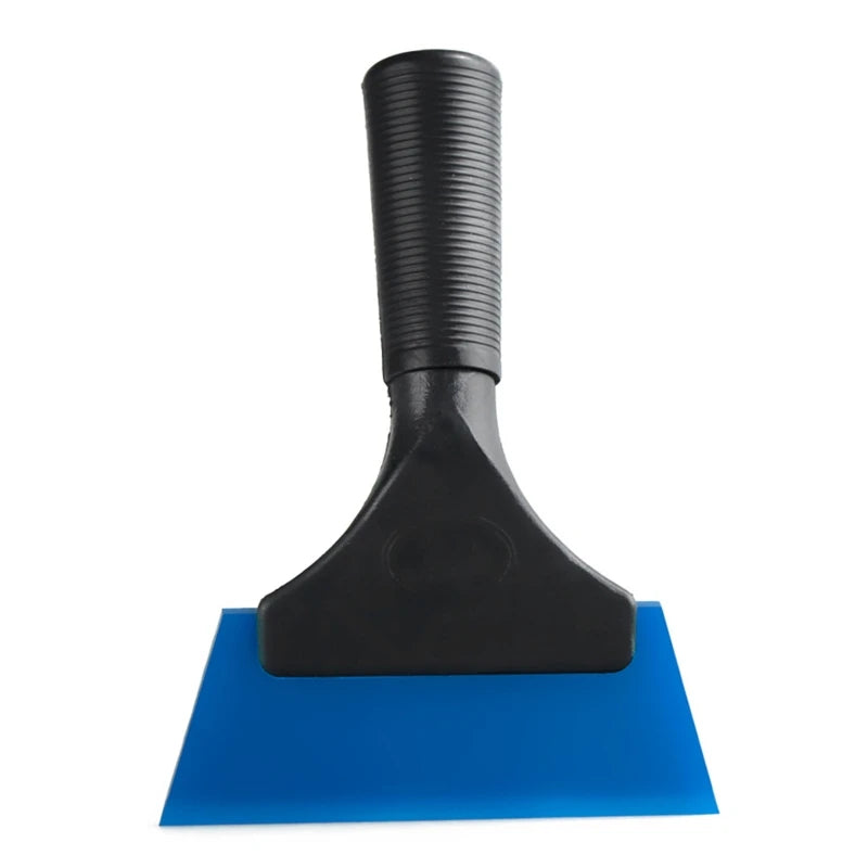 Black car window squeegee with a soft rubber blade resting on a blue surface.
