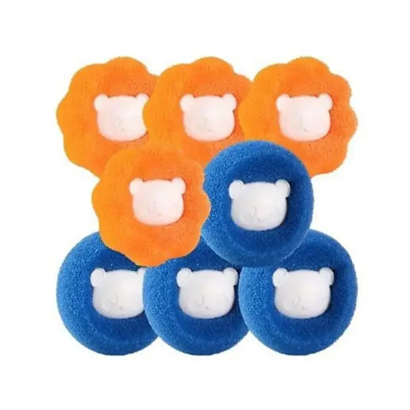 A set of reusable laundry balls with orange and blue fuzzy exteriors and white ears for pet hair removal.
