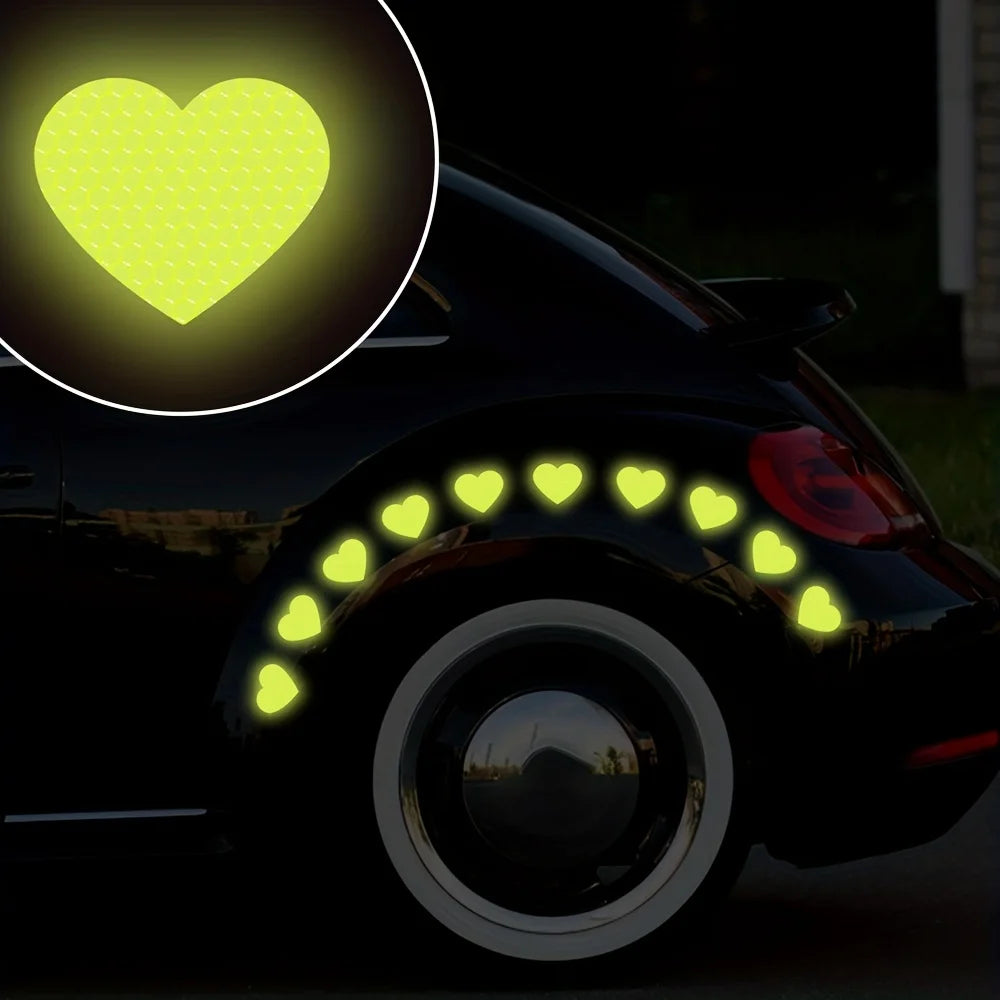 A black car features yellow heart stickers on the taillight and a glowing heart icon.