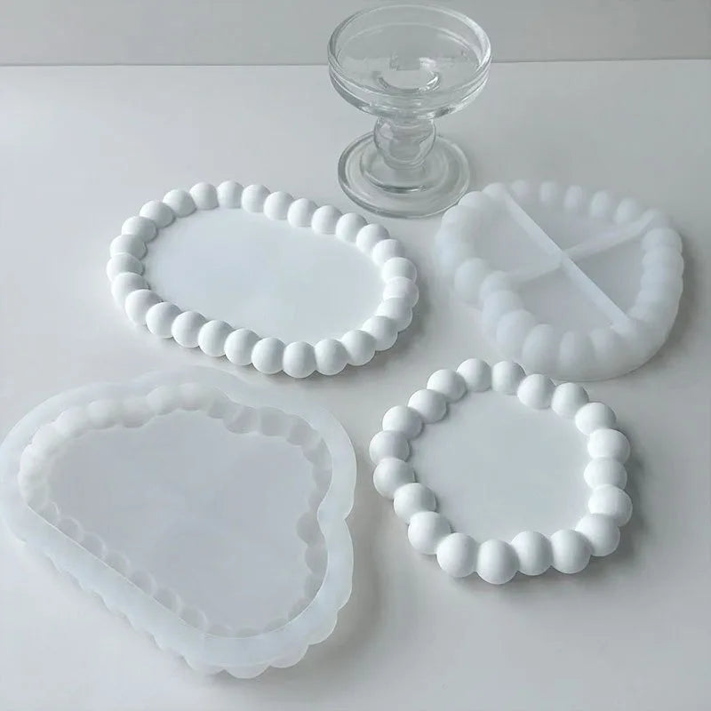 White silicone bubble tray molds for resin gypsum and clay crafts displayed on a white surface.