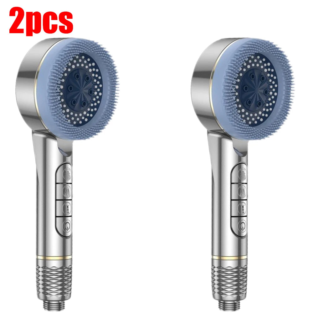 Two silver handheld shower heads with silicone nozzles are shown against a white background.