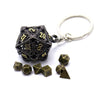 A set of dark metal dice with a hollow box and a silver keyring.