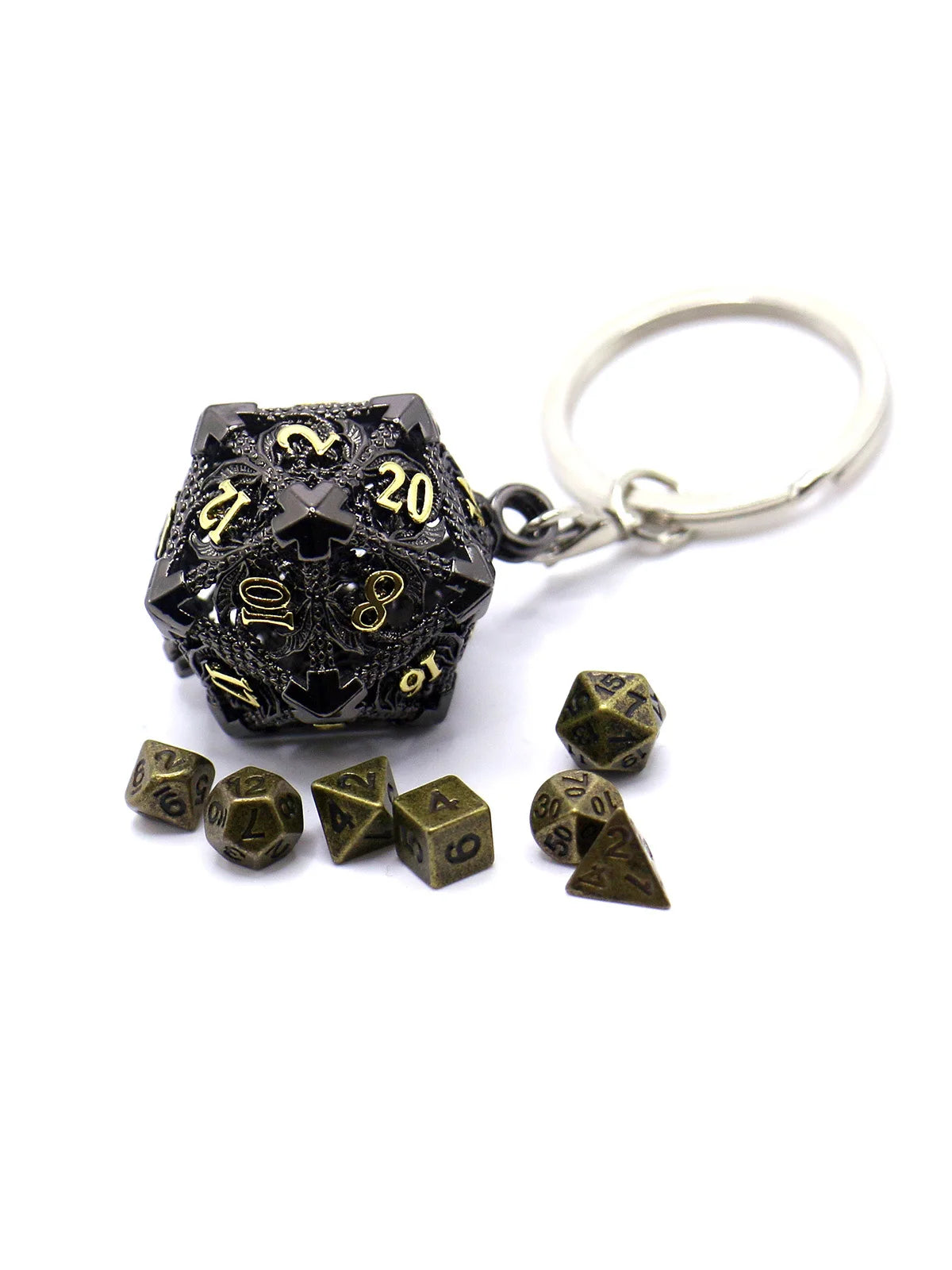 A set of dark metal dice with a hollow box and a silver keyring.