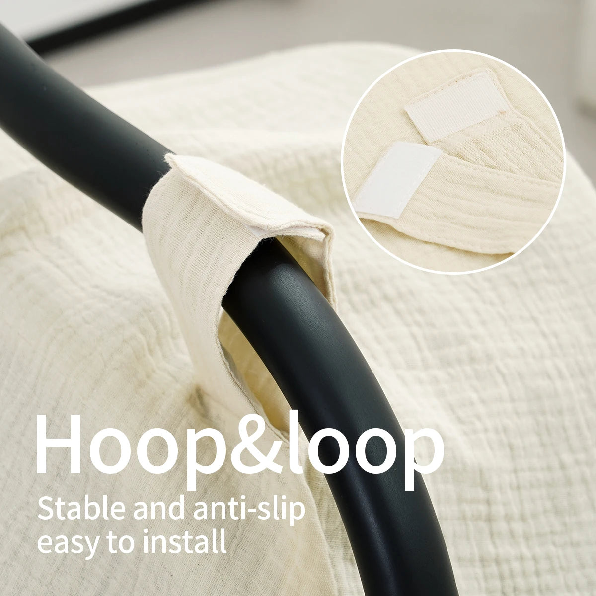 Close-up of a black hoop and loop strap attached to a beige fabric, showing an elastic band for easy installation.
