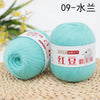 A ball of light turquoise yarn labeled 09-水兰三 for knitting and crochet
