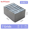 Grey foldable closet organizer box with seven grids for storing underwear, socks, and accessories