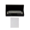 Black case for a 10-hole 20-tone harmonica in C key with a white tissue paper inside.