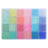 A storage box filled with 24 grids of multicolor acrylic rice beads in various shades of pink, green, and blue.