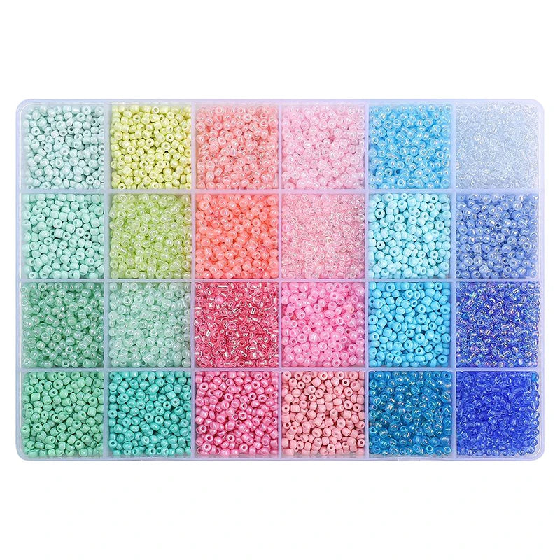A storage box filled with 24 grids of multicolor acrylic rice beads in various shades of pink, green, and blue.