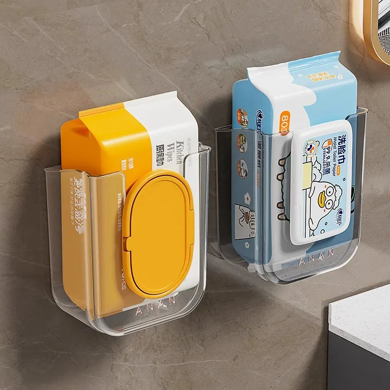 Set aus Kunststoff-Toilettenpapierdispensern in Gelb, Weiß und Hellblau.