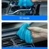 Demonstration of a reusable blue cleaning gel being used to clean various car interior surfaces like vents and a keyboard.