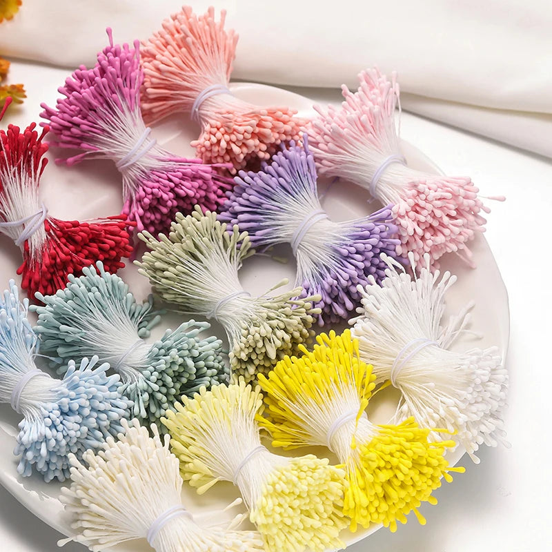 A collection of 400 pearl flower stamens in various shades of pink, purple, green, and yellow for DIY crafts and wedding deco